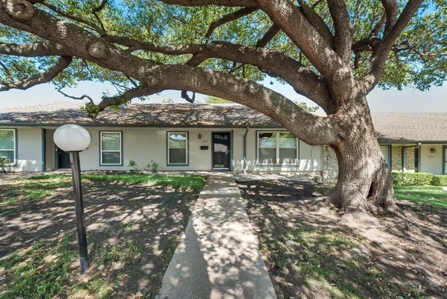 a view of a house with a tree and a tree