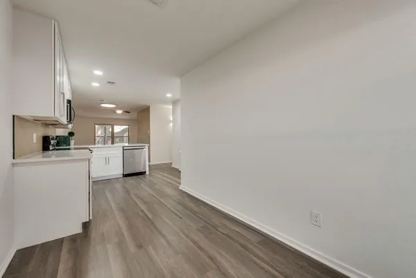 a view of kitchen with wooden floor