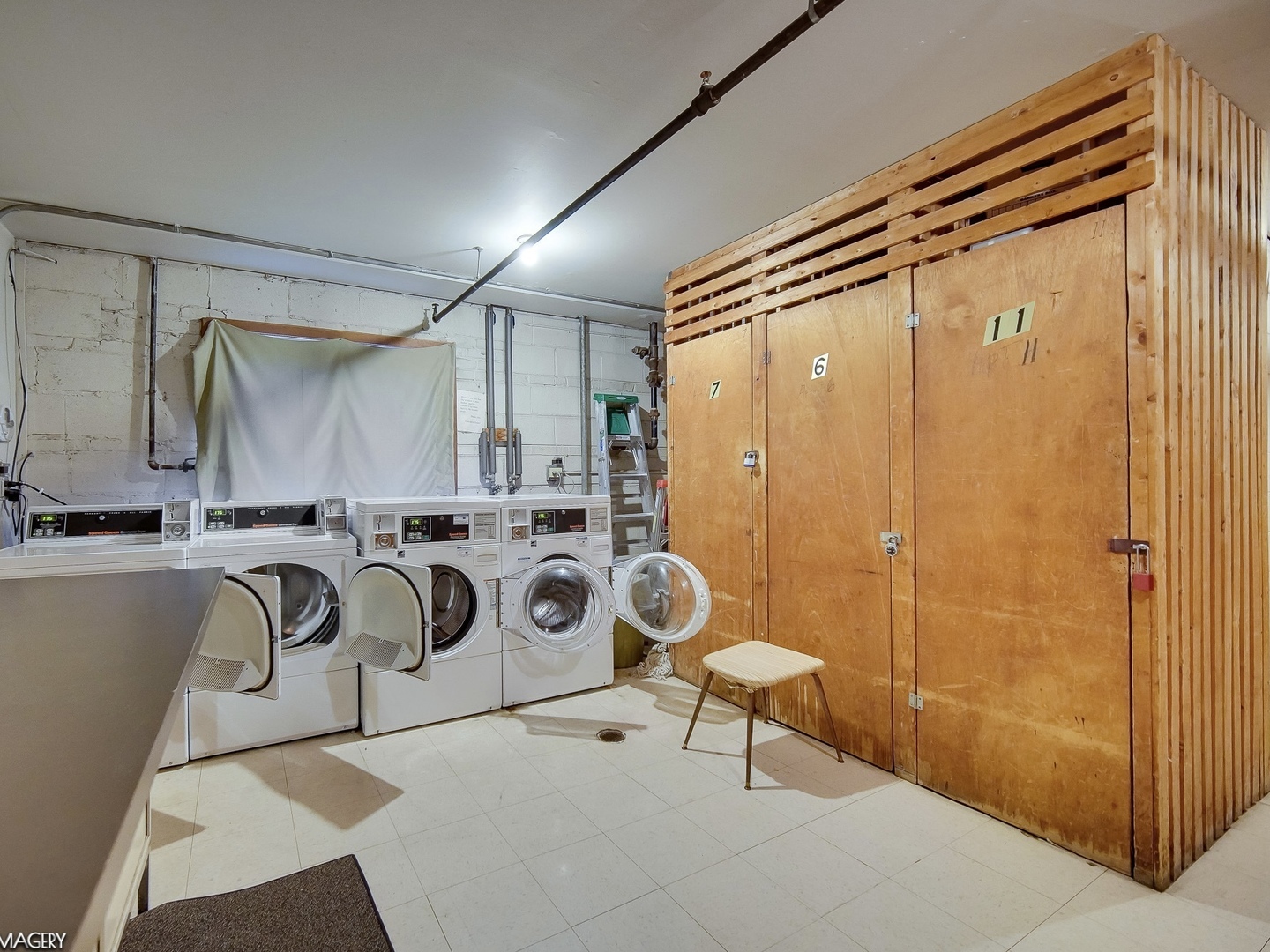 424 Elgin Avenue, Unit 7 Forest Park, IL 60130 - Photo 9 of 10 a bathroom with a sink a mirror and a shower