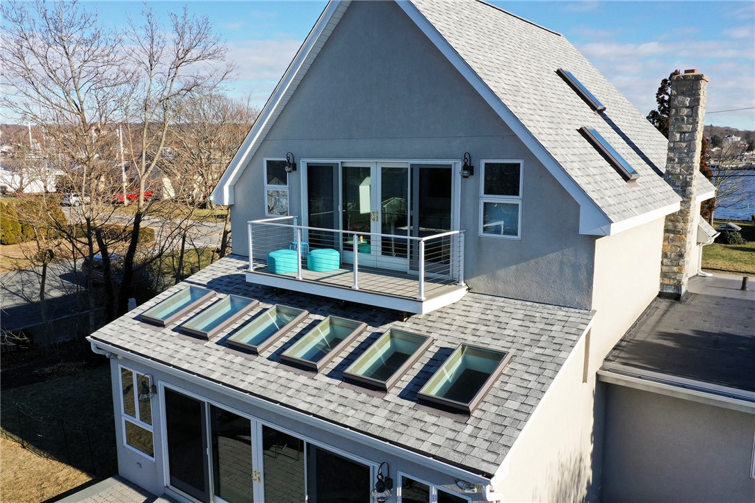78 Point Road Portsmouth, RI 02871 - Photo 15 of 43 Primary bedroom balcony with new wire railing and trek deck
