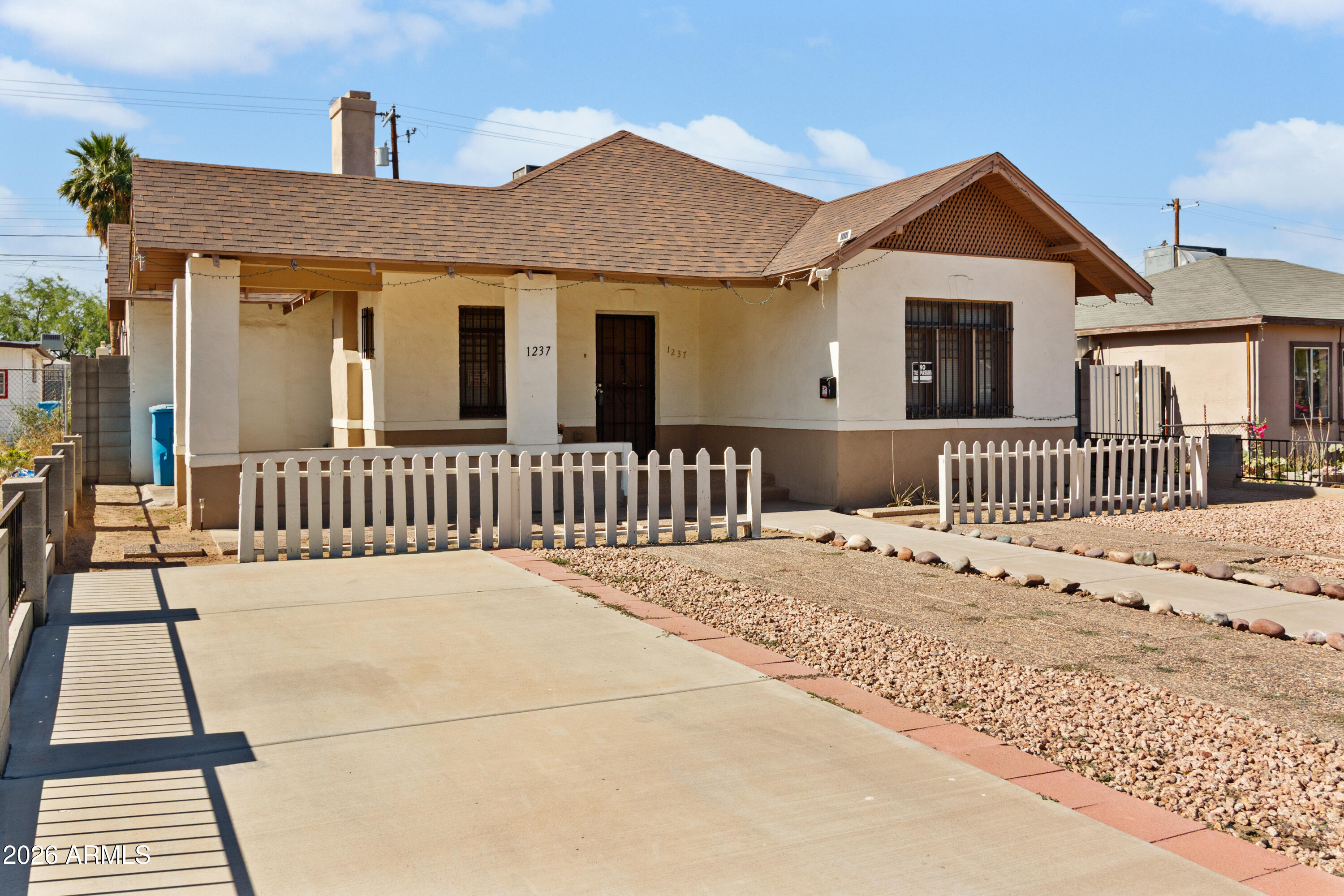 1237 East Pierce Street Phoenix, AZ 85006 - Photo 4 of 23 a front view of a house with a patio
