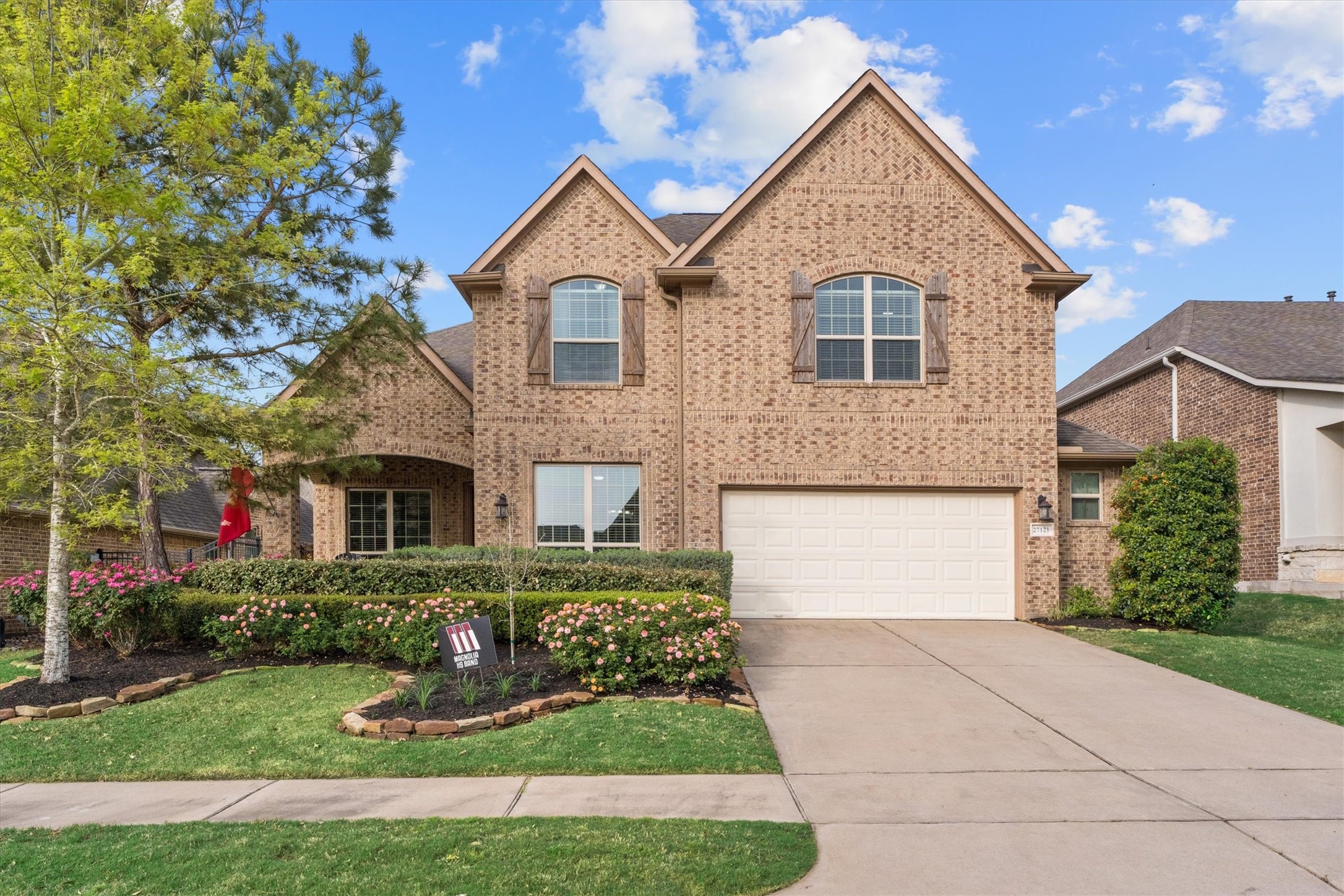 Stunning Curb Appeal! This beautifully landscaped home welcomes you with a spacious front patio—perfect for relaxing and enjoying the neighborhood. The lush greenery and charming design make a lasting first impression!