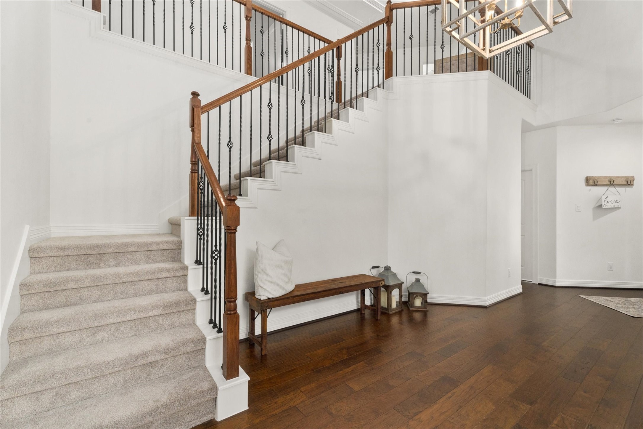 27121 Holtwood Grove Road Magnolia, TX 77354 - Photo 12 of 50 Elegant staircase leading to the upper level, featuring three spacious bedrooms, two modern bathrooms, a versatile game room, and a cozy media room. Recently updated with sleek countertops and plush new carpeting, offering both style and comfort.