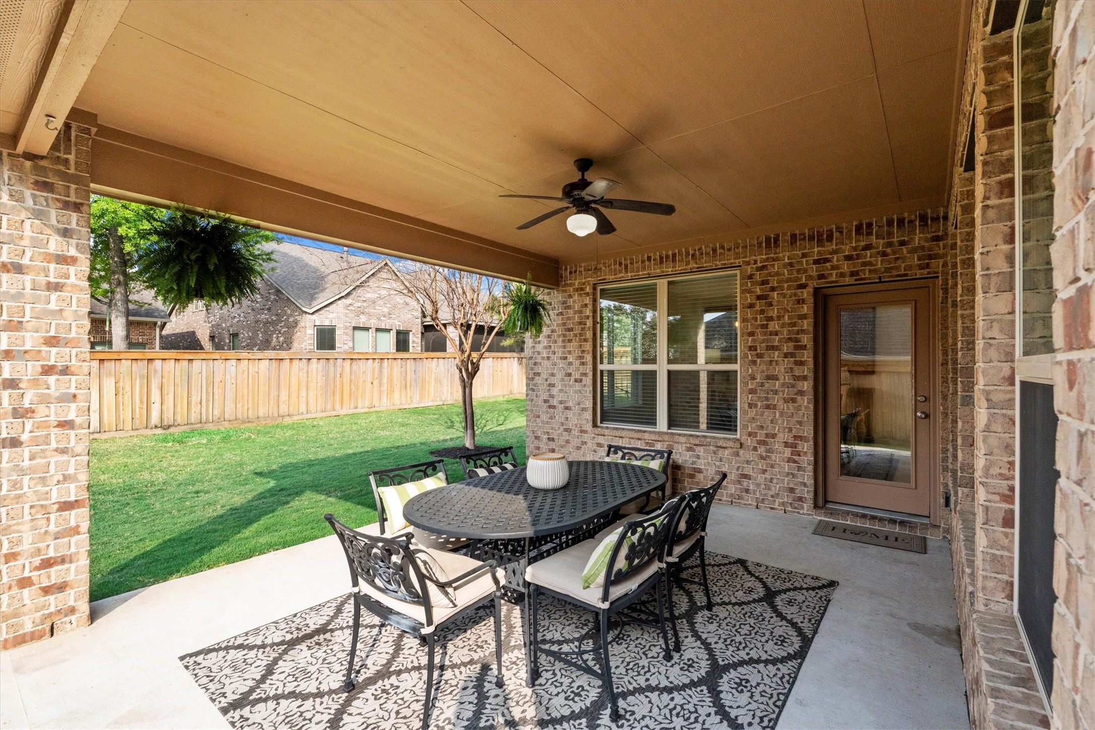 27121 Holtwood Grove Road Magnolia, TX 77354 - Photo 46 of 50 The extended back patio offers ample space to unwind, entertain, or enjoy outdoor dining. Whether you’re grilling, relaxing, or hosting gatherings, this versatile area adapts to suit your lifestyle, creating the perfect outdoor retreat.