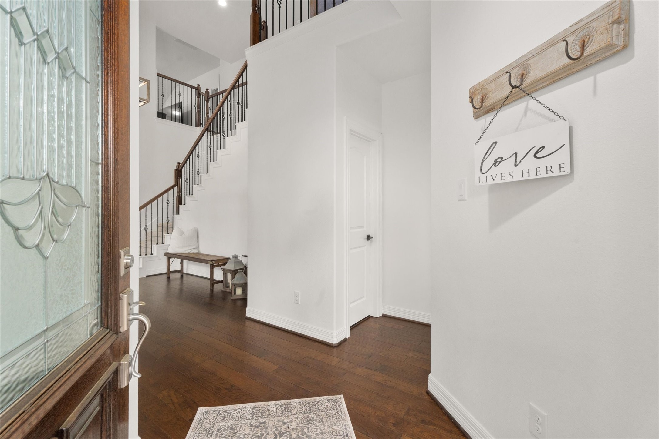 27121 Holtwood Grove Road Magnolia, TX 77354 - Photo 5 of 50 Step inside and be greeted by soaring ceilings and an abundance of natural light. This elegant entryway sets the tone for the beauty and openness found throughout the home!