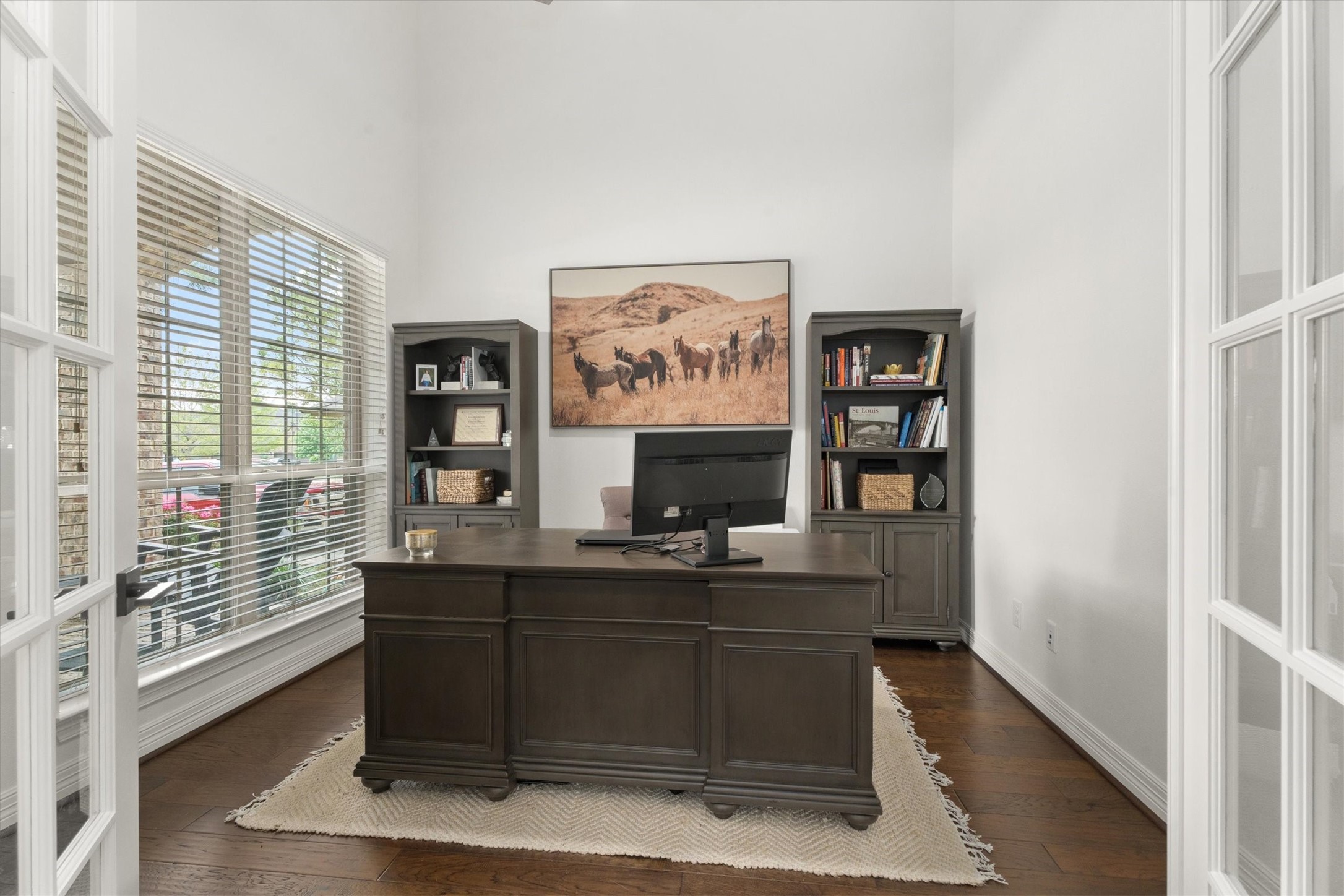 27121 Holtwood Grove Road Magnolia, TX 77354 - Photo 7 of 50 Just off the entry, this bright and airy office features soaring ceilings, beautiful French doors, and plenty of natural light. The perfect space for productivity, creativity, or a quiet retreat!