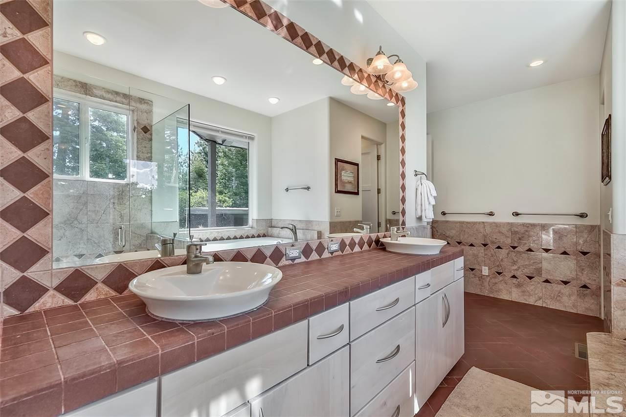 230 Chimney Rock Road Stateline, NV 89449 - Photo 17 of 25 a bathroom with a sink double vanity and a mirror