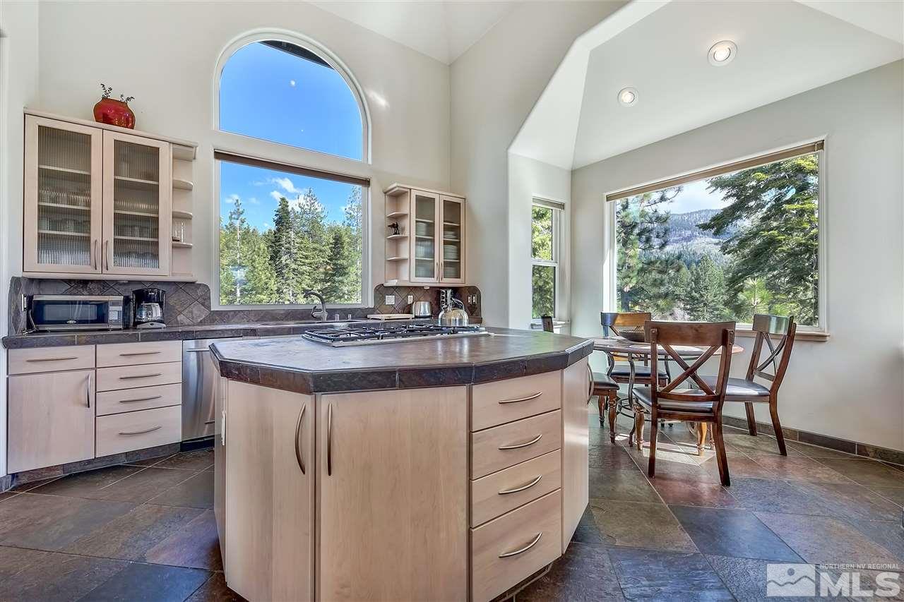 230 Chimney Rock Road Stateline, NV 89449 - Photo 6 of 25 a kitchen with a table chairs and wooden floor