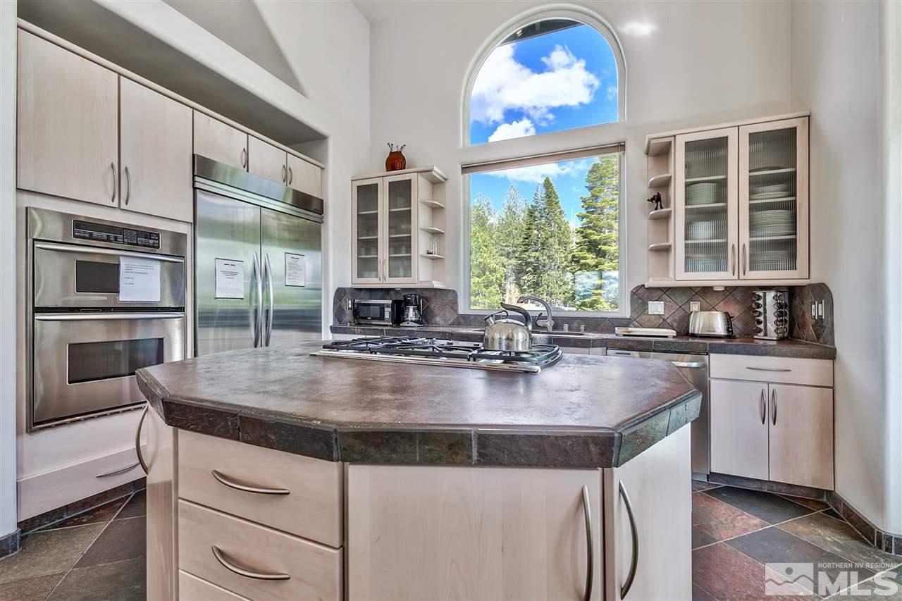230 Chimney Rock Road Stateline, NV 89449 - Photo 7 of 25 a kitchen with stainless steel appliances granite countertop a stove and a sink