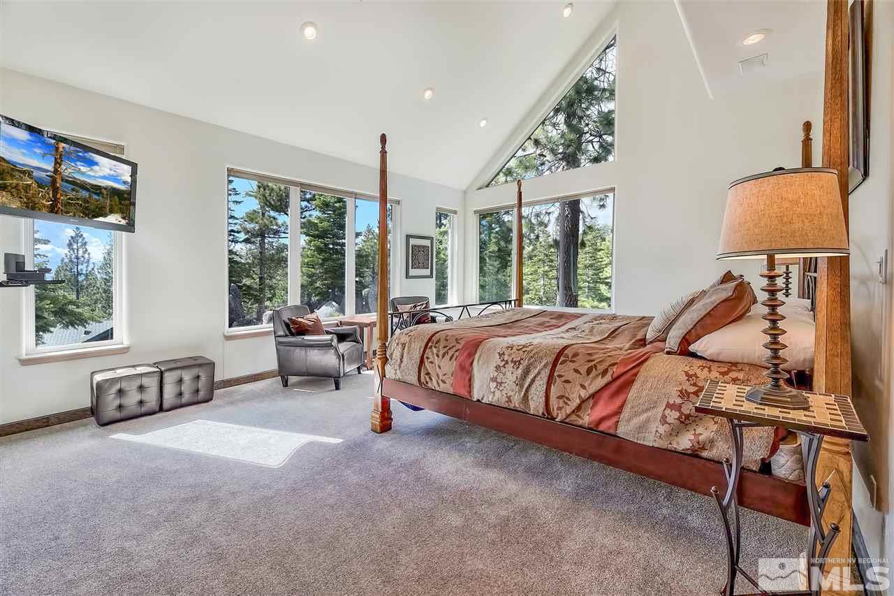 230 Chimney Rock Road Stateline, NV 89449 - Photo 10 of 25 a bedroom with a bed chair and window