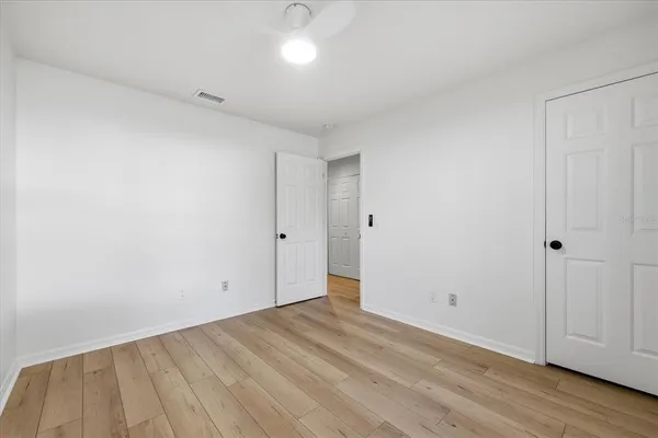 a view of room with wooden floor