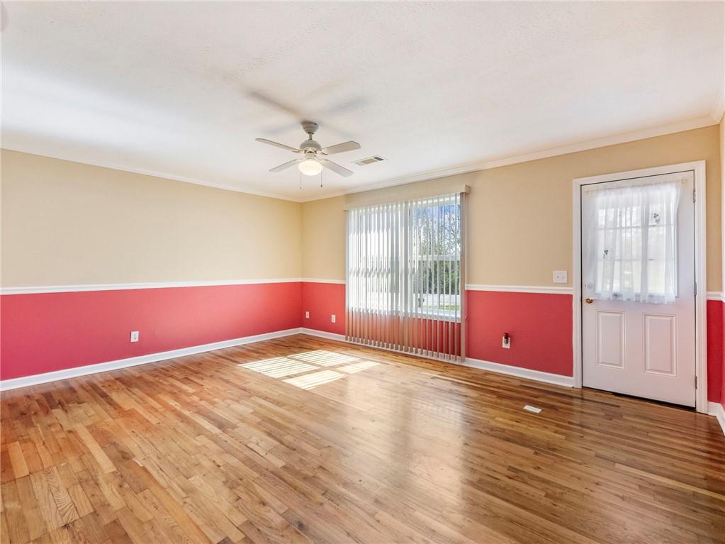 1686 Shoal Creek Road Monroe, GA 30656 - Photo 5 of 50 a bedroom with a bed and wooden floor