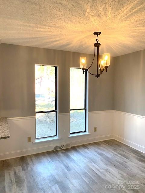 11112 5 Cedars Road Charlotte, NC 28226 - Photo 16 of 25 an empty room with wooden floor fan and windows