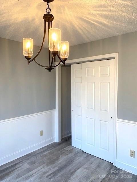 11112 5 Cedars Road Charlotte, NC 28226 - Photo 17 of 25 a view of a chandelier fan and wooden floor