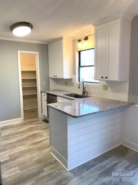 11112 5 Cedars Road Charlotte, NC 28226 - Photo 19 of 25 a kitchen with granite countertop a sink window and cabinets