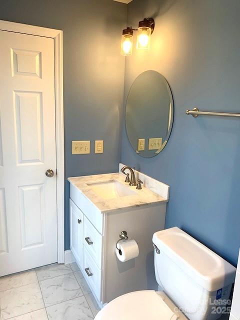 11112 5 Cedars Road Charlotte, NC 28226 - Photo 21 of 25 a bathroom with a granite countertop toilet sink and mirror