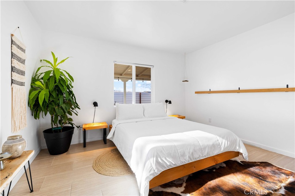61879 Valley View Circle Joshua Tree, CA 92252 - Photo 5 of 63 a bedroom with a bed and a potted plant