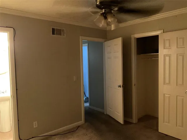 a view of a hallway with a chandelier