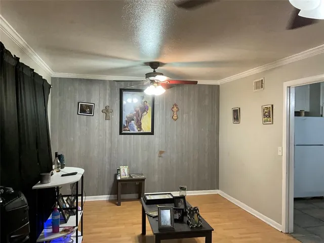 a view of a livingroom with furniture and gym equipment