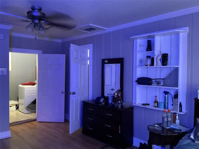 a bed room with a bed and a dresser