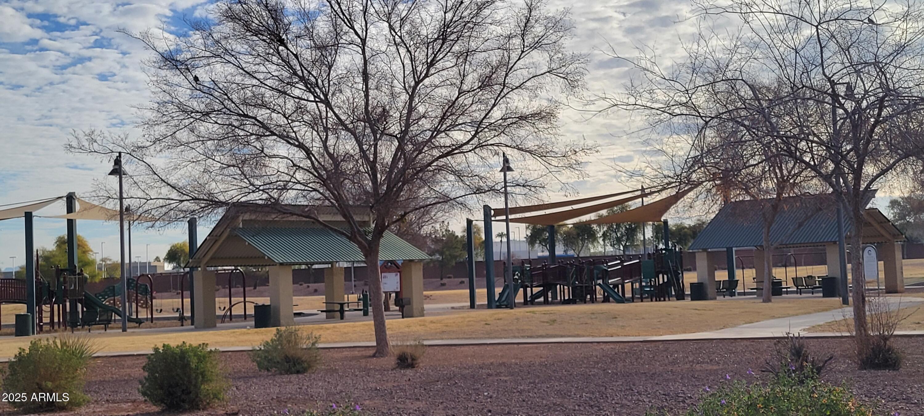2600 East Springfield Place, Unit 108 Chandler, AZ 85286 - Photo 12 of 13 a front view of a building and trees
