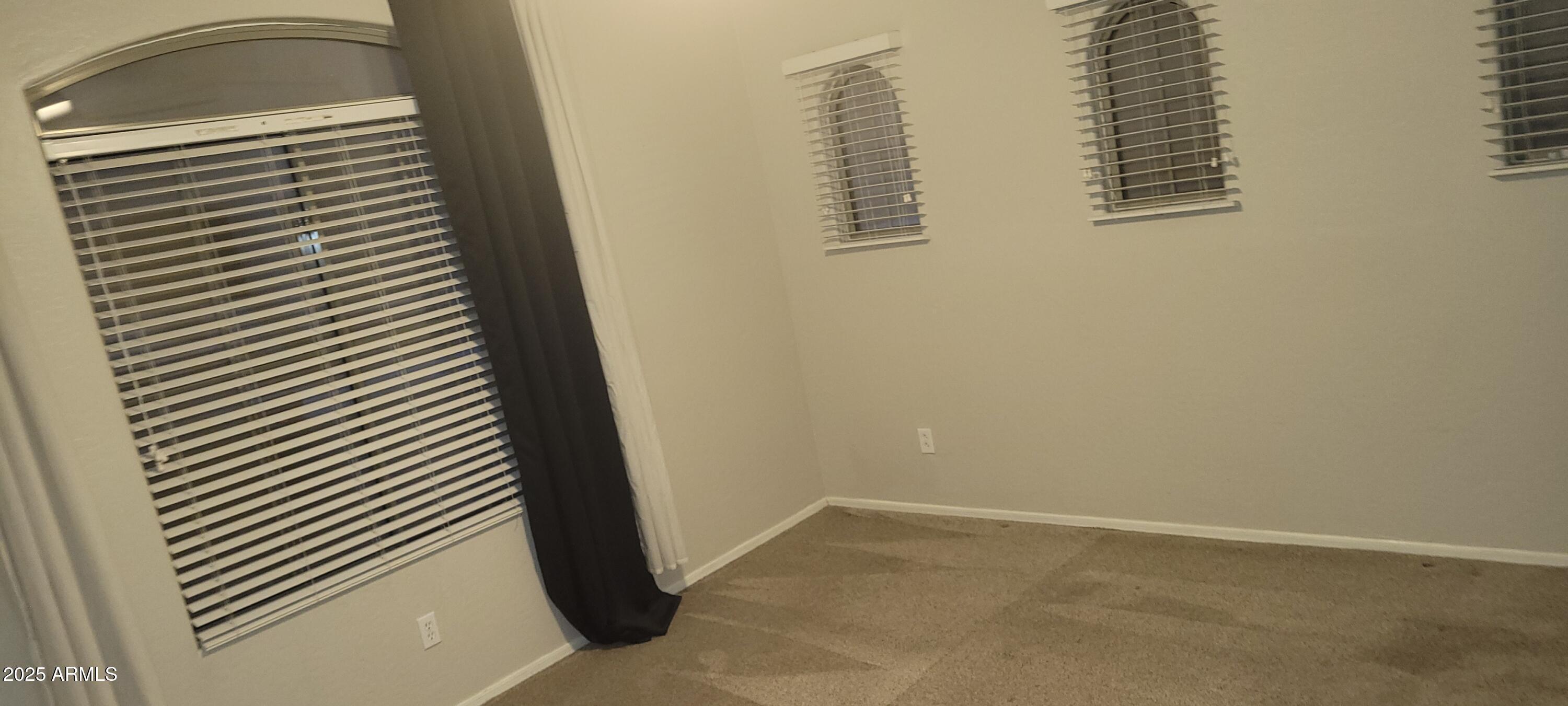 2600 East Springfield Place, Unit 108 Chandler, AZ 85286 - Photo 7 of 13 a view of a small space with racks on the wall