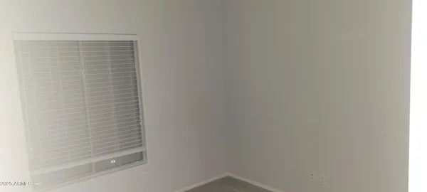 a white toilet sitting next to a shower