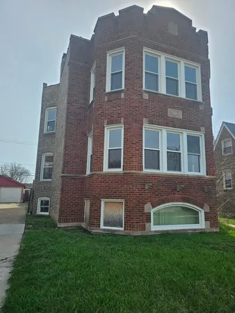 a brick building view that has a lots of windows in it