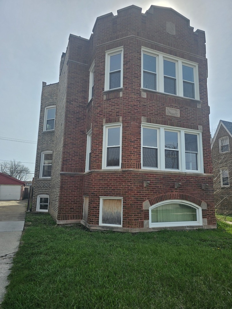 9439 South Racine Avenue Chicago, IL 60620 - Photo 1 of 11 a brick building view that has a lots of windows in it