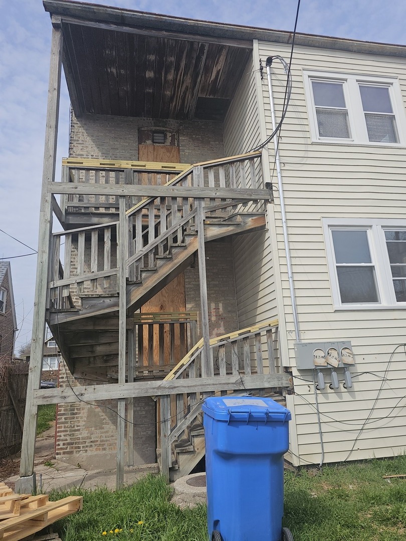 9439 South Racine Avenue Chicago, IL 60620 - Photo 11 of 11 a front view of a house with a yard