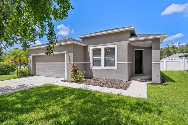 front view of a house with a yard
