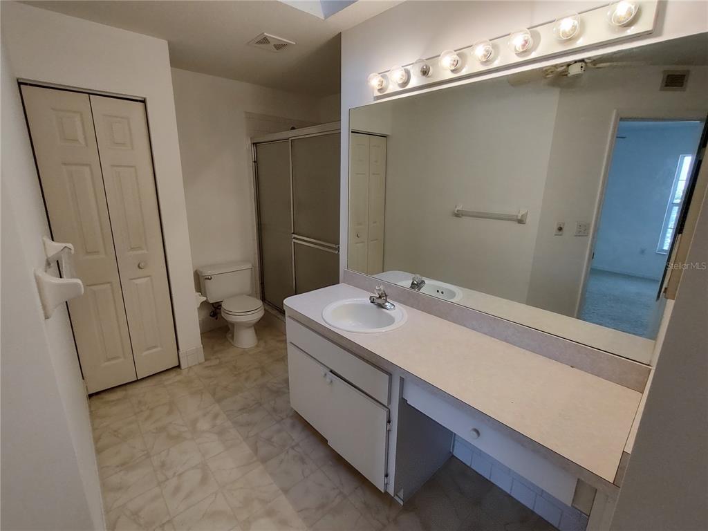 7257 Southwest 115th Place Ocala, FL 34476 - Photo 13 of 18 a bathroom with a sink a toilet and shower