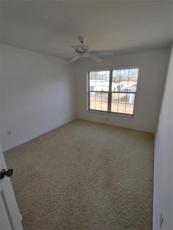 7257 Southwest 115th Place Ocala, FL 34476 - Photo 15 of 18 a view of an empty room with a window