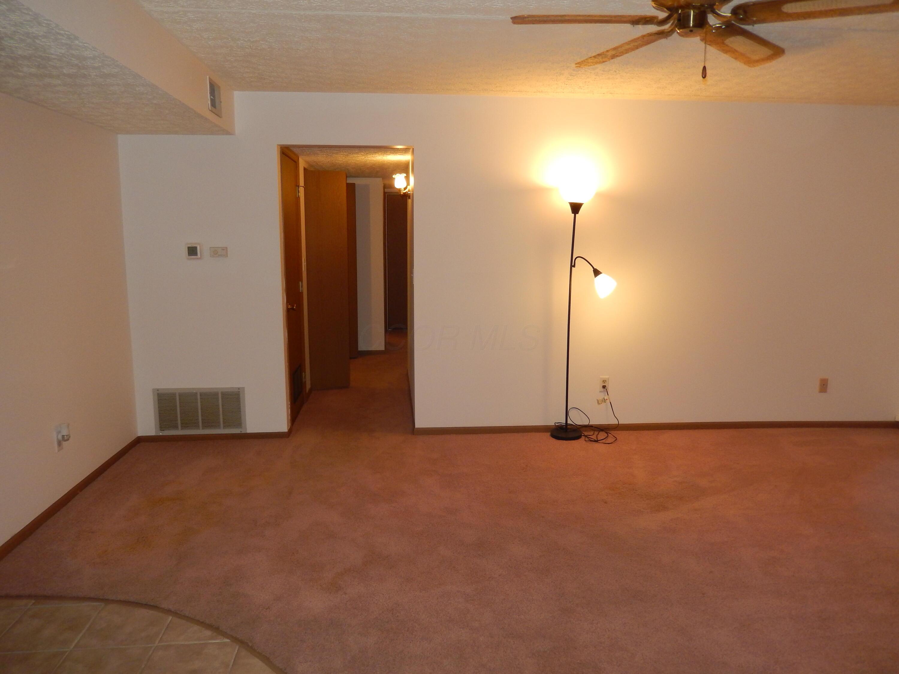 3939 Karl Road, Unit 122 Columbus, OH 43224 - Photo 9 of 57 Living Room with ceiling fan