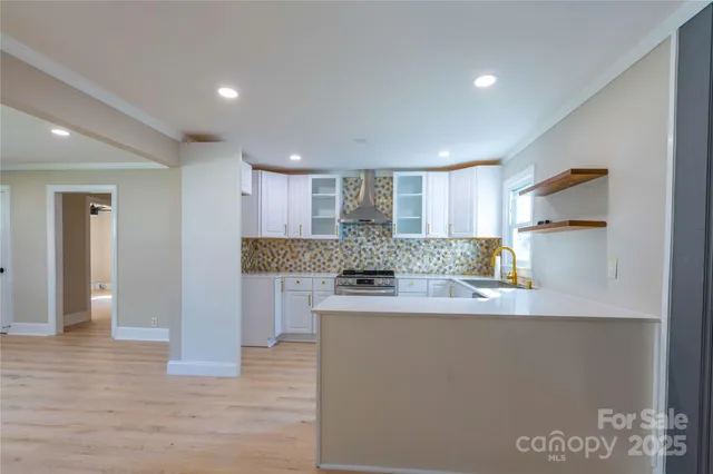 a kitchen with a sink stove and cabinets