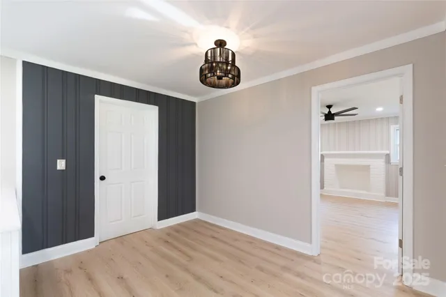 a view of a kitchen with wooden floor and a kitchen