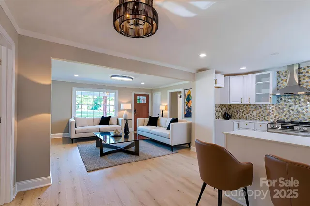 a kitchen with cabinets appliances and a window