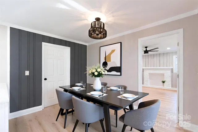 a bathroom with a toilet a sink a mirror and a window