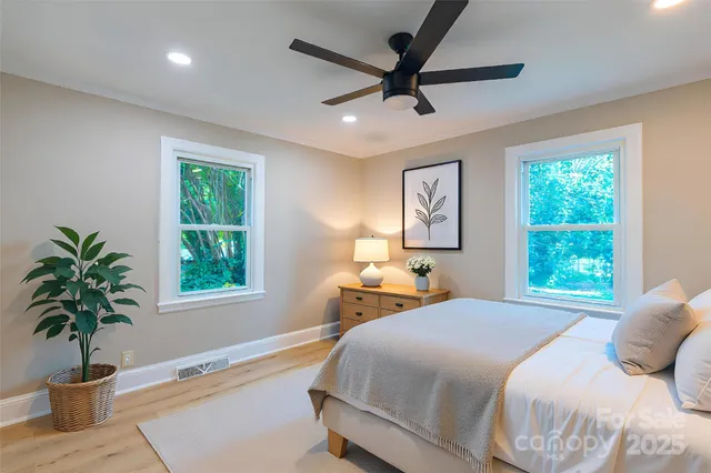 a spacious bedroom with a large bed and a window