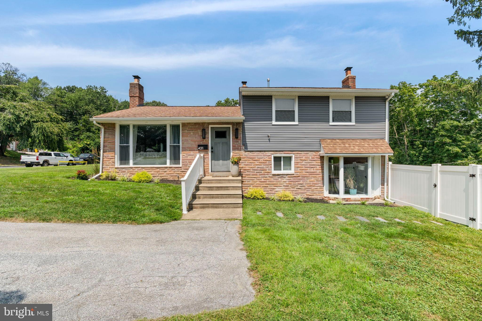 431 Penn Lane Springfield, PA 19064 - Photo 1 of 37 Charming split-level home with lush greenery.