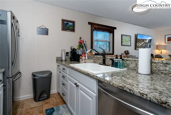 a kitchen with a stove and a sink