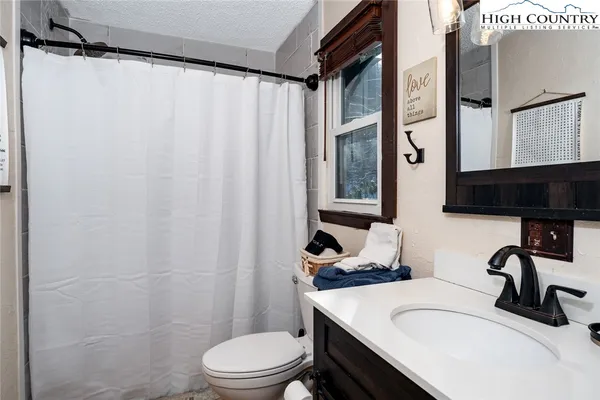 a bathroom with a sink and toilet