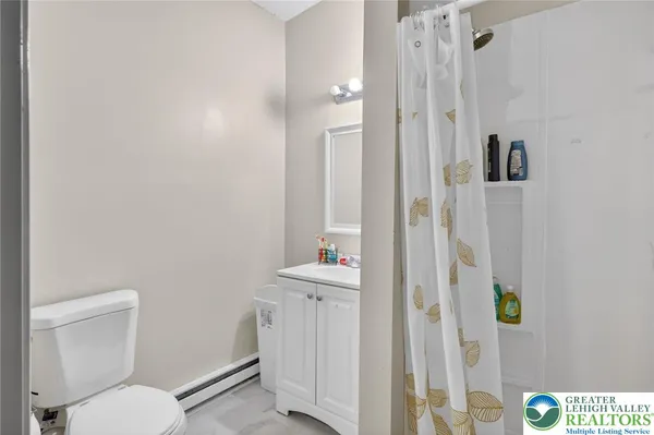 a bathroom with a toilet and a sink