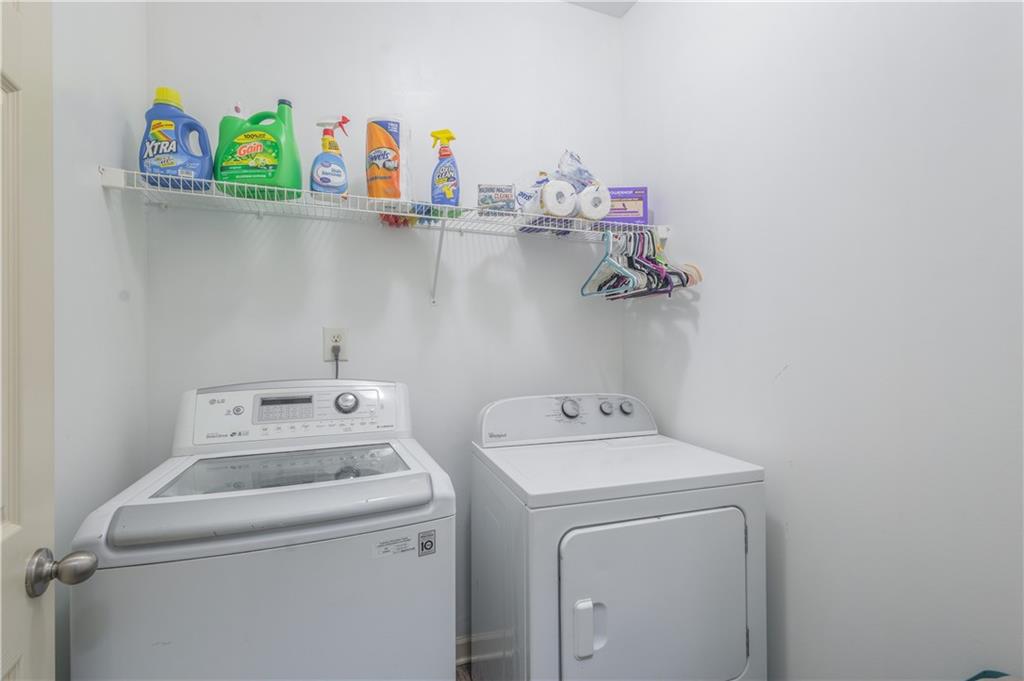 21 Sunny Point Newnan, GA 30263 - Photo 18 of 33 a utility room with dryer and washer