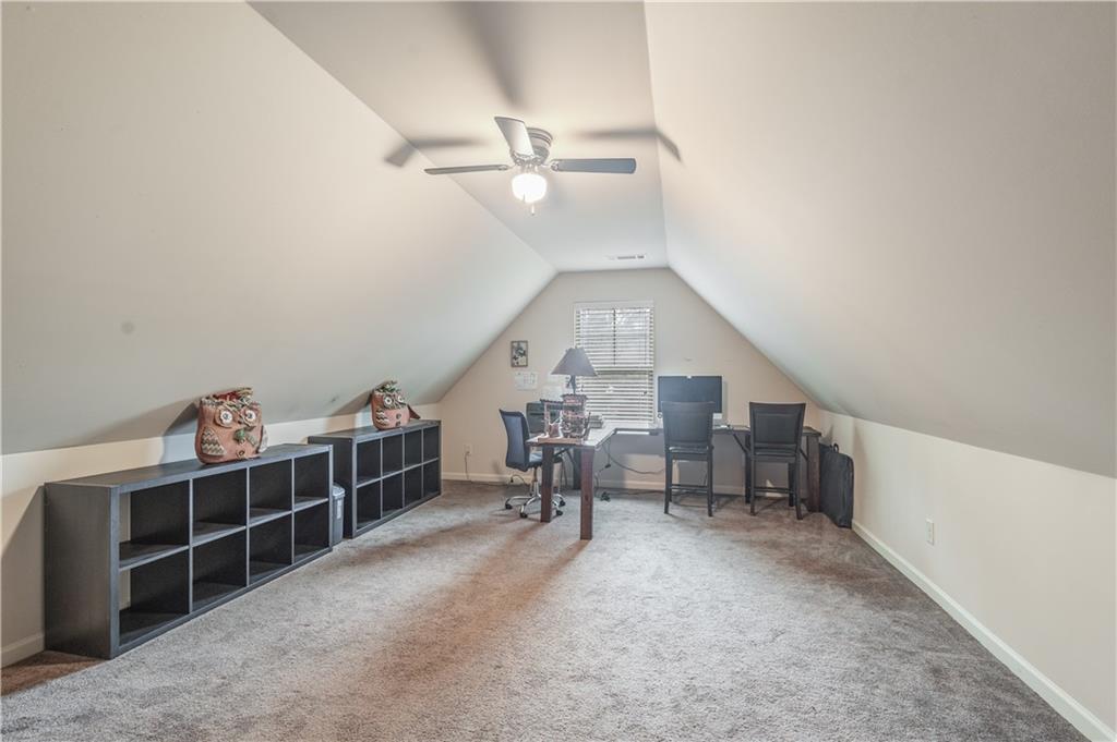 21 Sunny Point Newnan, GA 30263 - Photo 10 of 33 a view of a livingroom with furniture and staircase