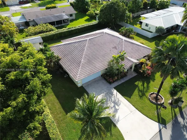 a view of a house with a yard and garden