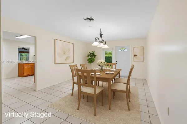 a view of an empty room with a ceiling fan and window