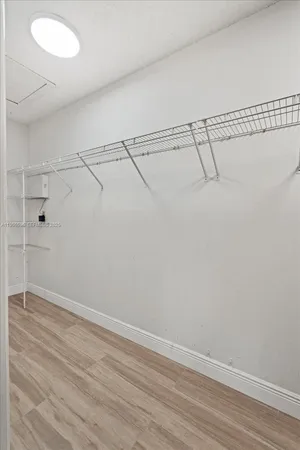 a bathroom with a double vanity sink a toilet and a mirror