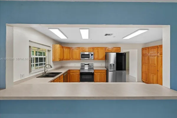 a view of a porch with furniture and yard