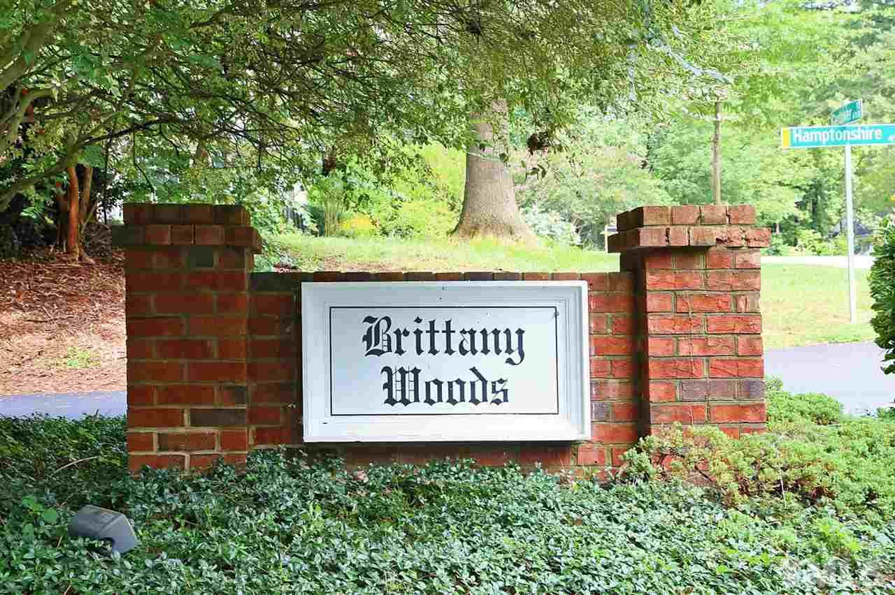 4518 Hamptonshire Drive Raleigh, NC 27613 - Photo 21 of 24 a sign on the side of a building